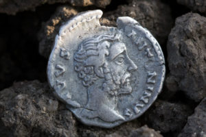 Ancient Roman silver coin showing the portrait of the emperor Ancient Roman silver coin showing the portrait of the emperor